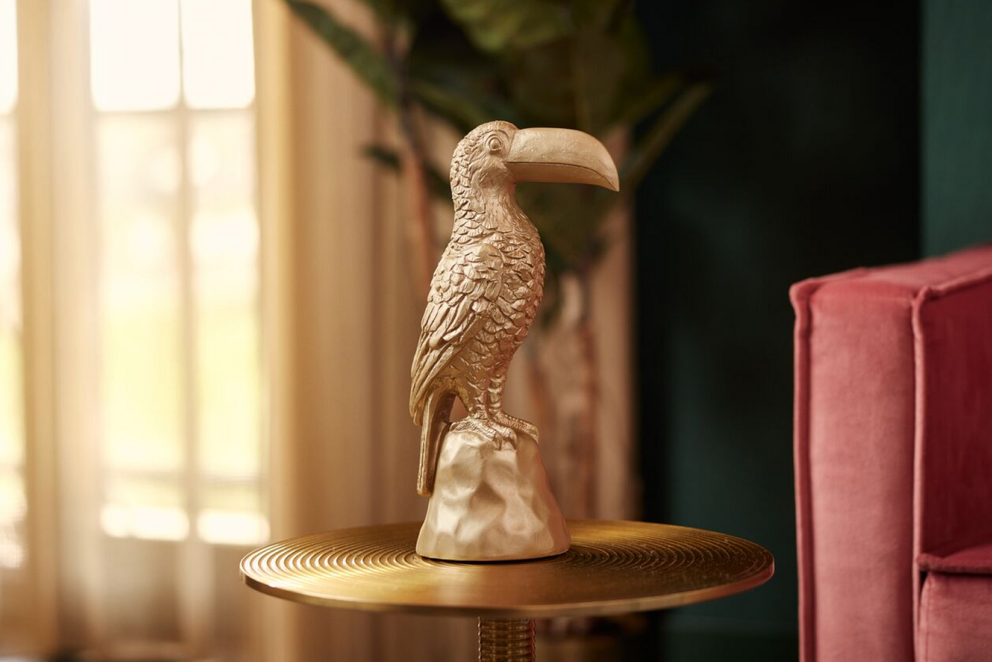 Statue du toucan doré
